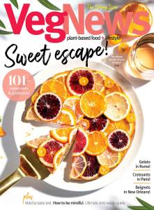 White plate with citrus-covered tart on a white background